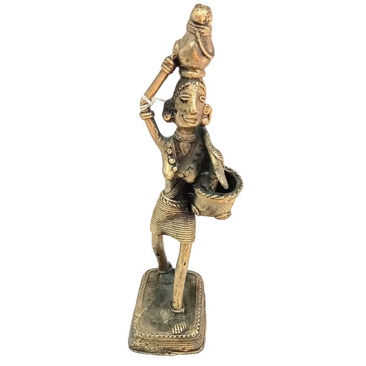 Bastar Handcrafted Female Metal Tribe Carring the products on her Head