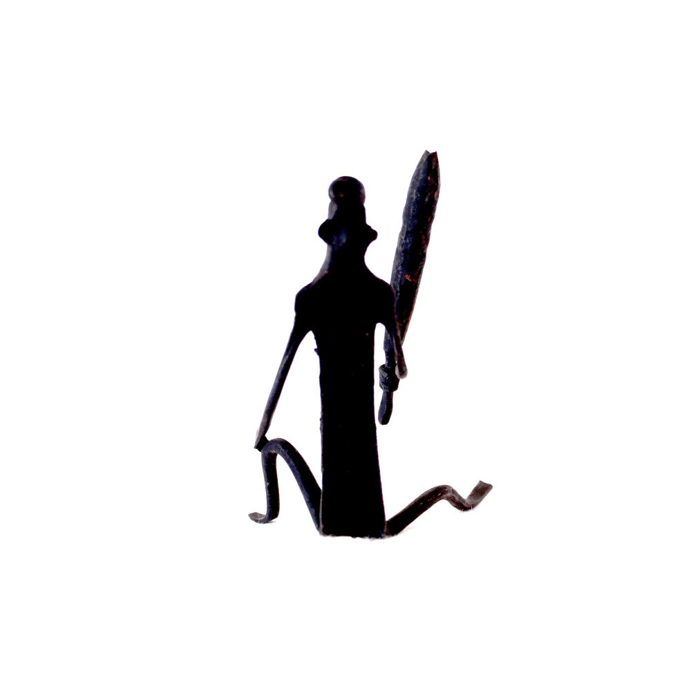 Tribal lady grinding grains