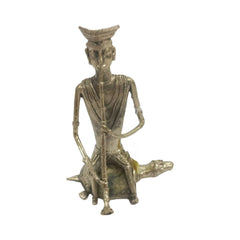 Tribal Man sitting on the Tortoise and Playing Flute