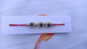 Rakhi with Blue & White Beads