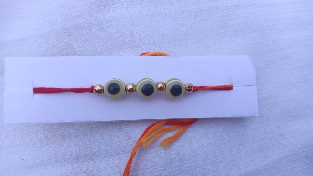 Rakhi with Green with Blue Beads